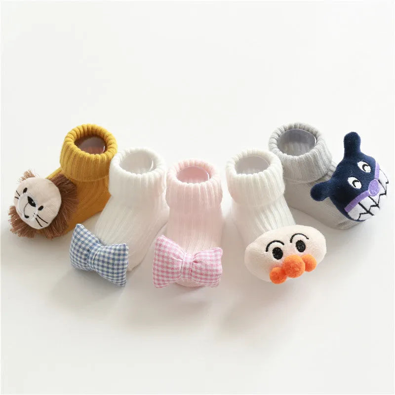 Cotton baby floor socks with non-slip soles in a pink bow print design.