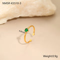 Open-ended geometric stainless steel ring with a green zircon heart inlay on a grey background.