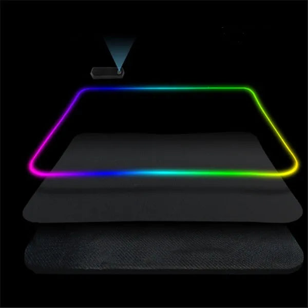 Luminous table mat gaming mouse pad with RGB illumination and non-slip rubber base in black on a wooden desk
