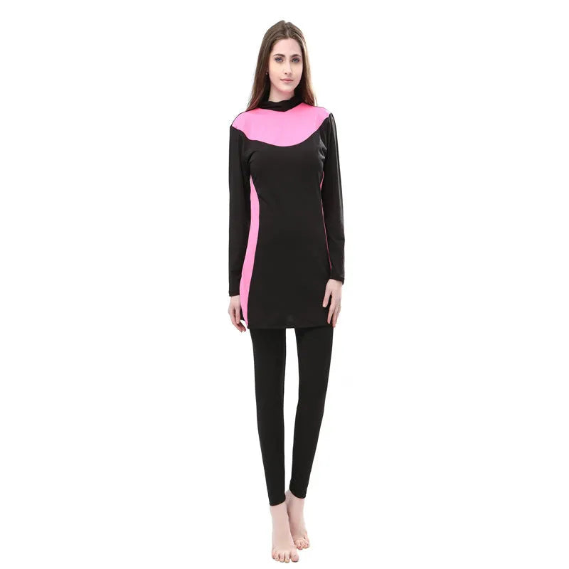 Conservative women's hooded long sleeve swimsuit in black with colour trim.