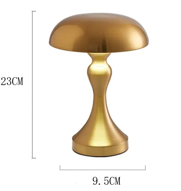 LED desk lamp in bronze finish with USB charging cable and touch controls for three colour temperatures