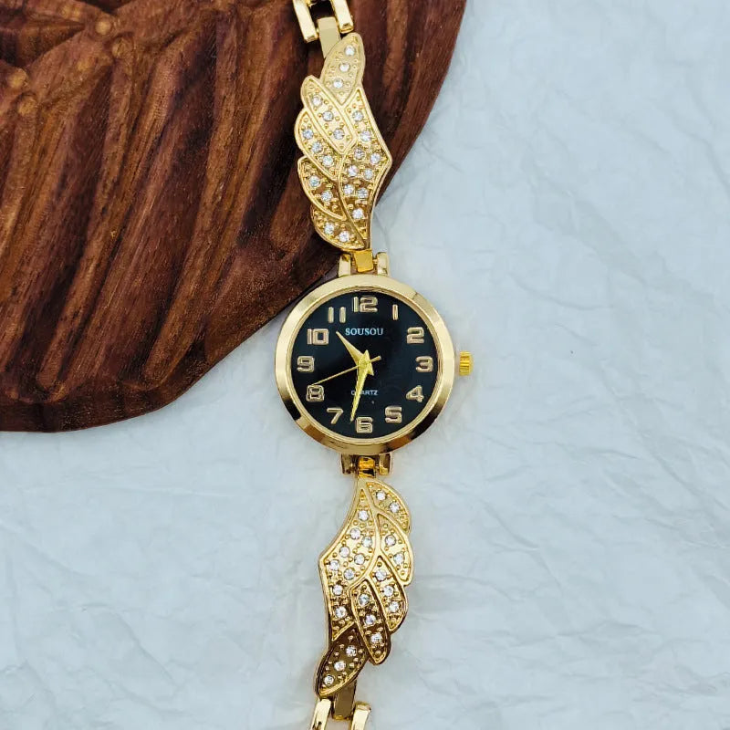 Women's stainless steel watch with round gold surface dial and vachette clasp