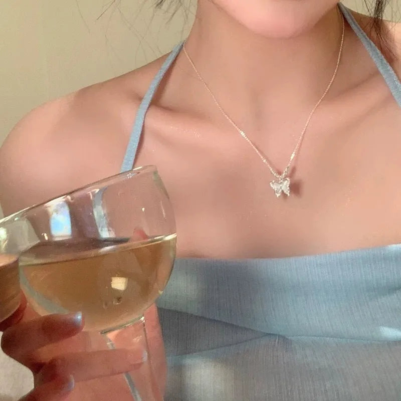 Silver butterfly necklace with square opal pendant on adjustable cross chain