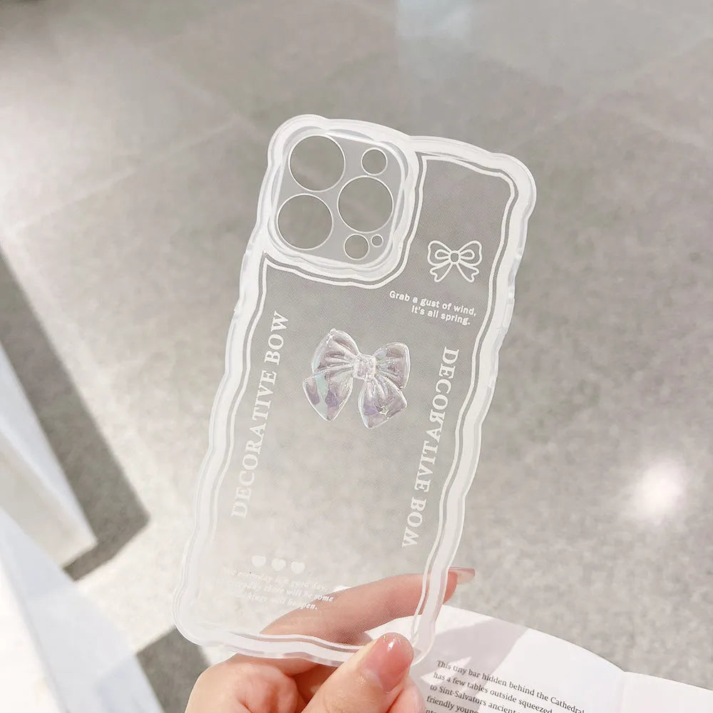 Transparent iPhone case with raised ice-through bow design and white love lanyard attachment