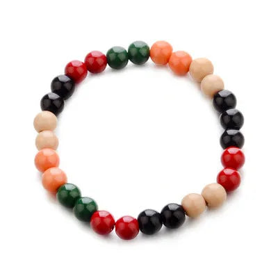 Natural lava stone beaded bracelet for men and women on a neutral background.