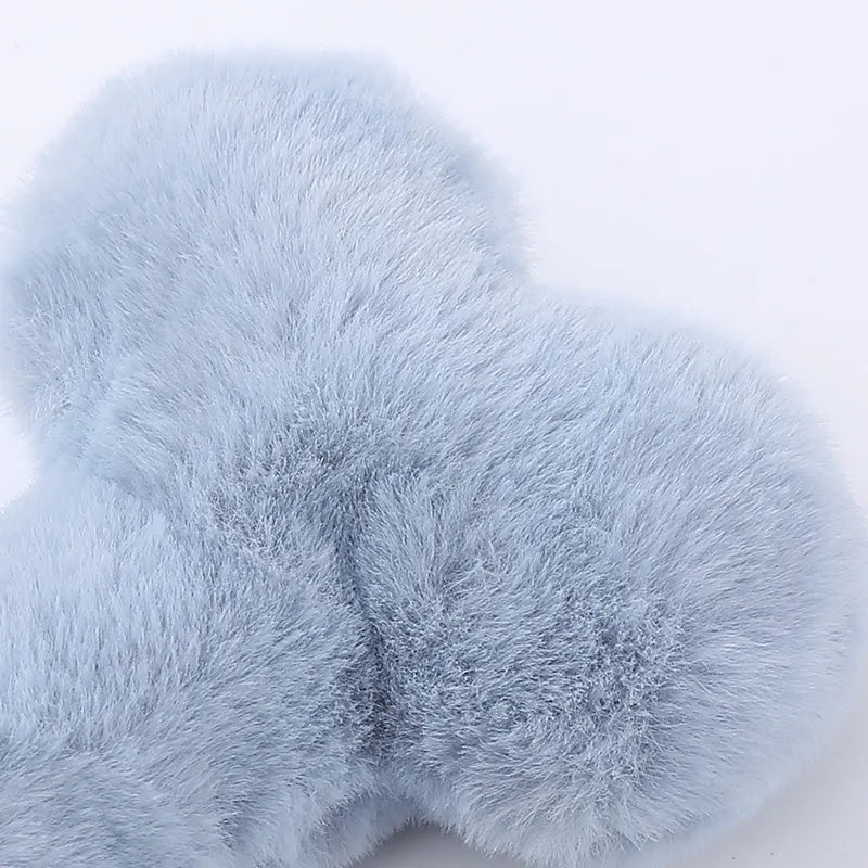 Blue love bone shaped dog plush toy with a squeaker, shown next to pink and yellow colour options.