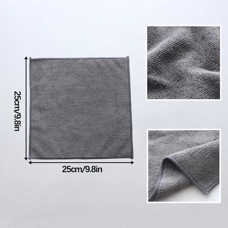 Grey square microfiber kitchen cleaning cloth for oil and grease removal on pots.