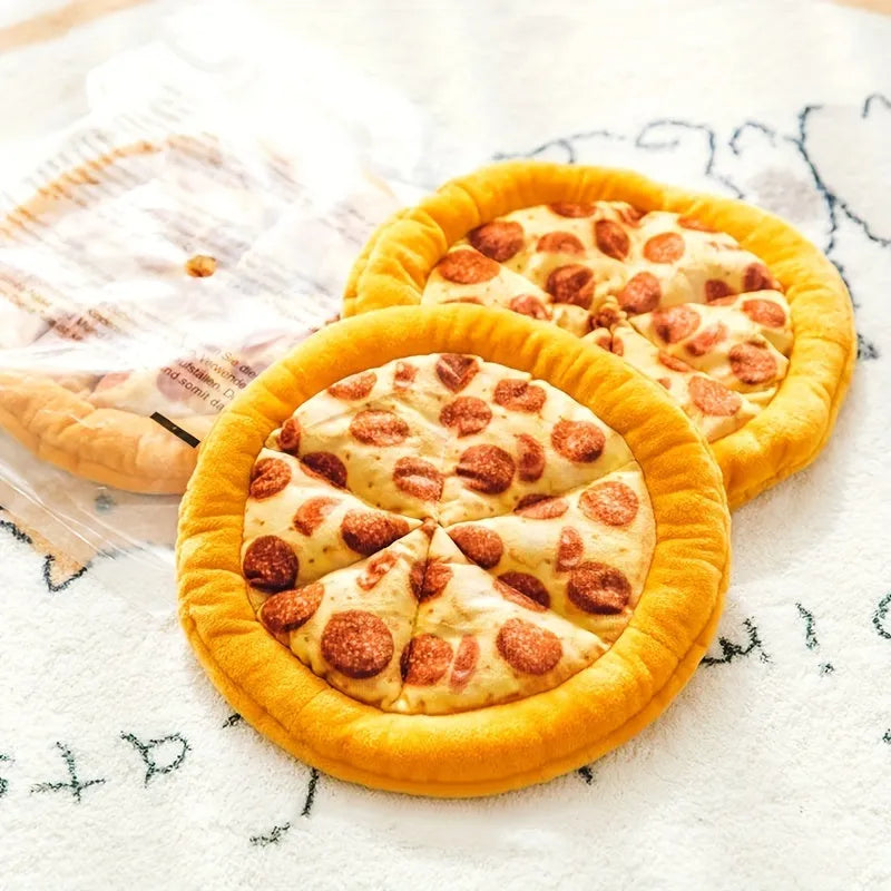 Yellow pizza slice shaped soft plush dog chew toy with squeaker on a white background.