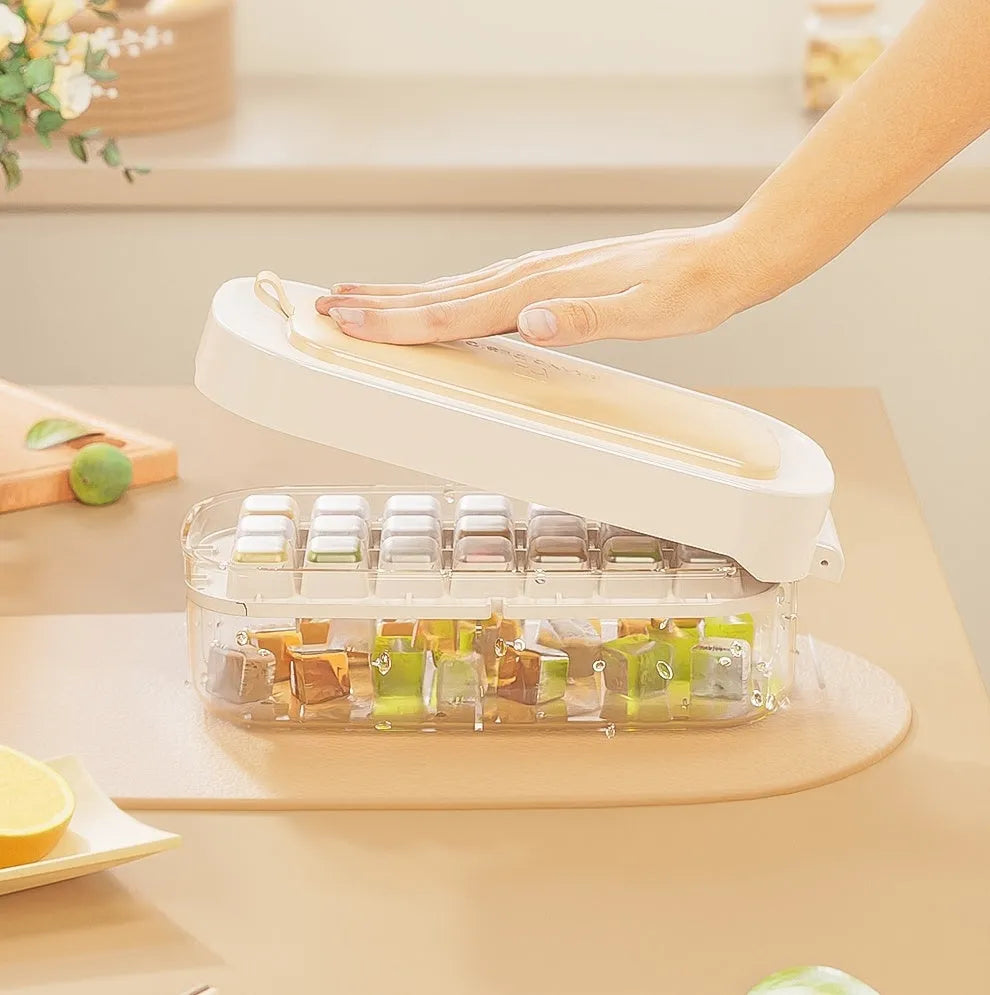 Yellow high-capacity grid ice cube tray with integrated storage slot for an ice shovel