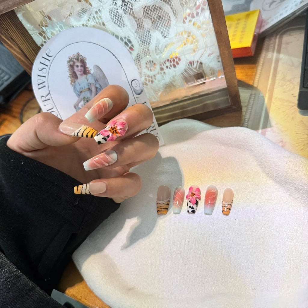 Hand carved false nails featuring a textured zebra pattern lily design in sizes XS, S, M, L.
