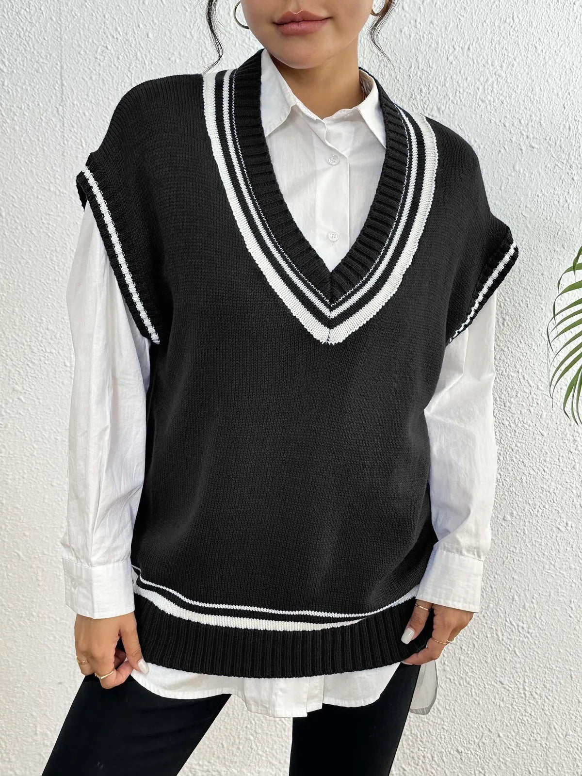 Women's college style wool vest sweater in loose pullover design available in blue coffee black colours
