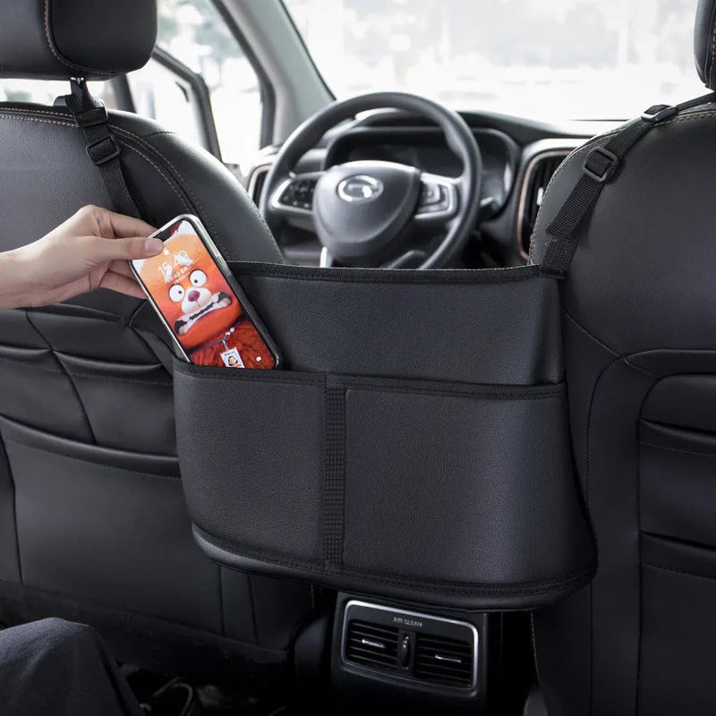 Black leather car seat storage bag with carbon fibre pattern measuring 38x24x15cm