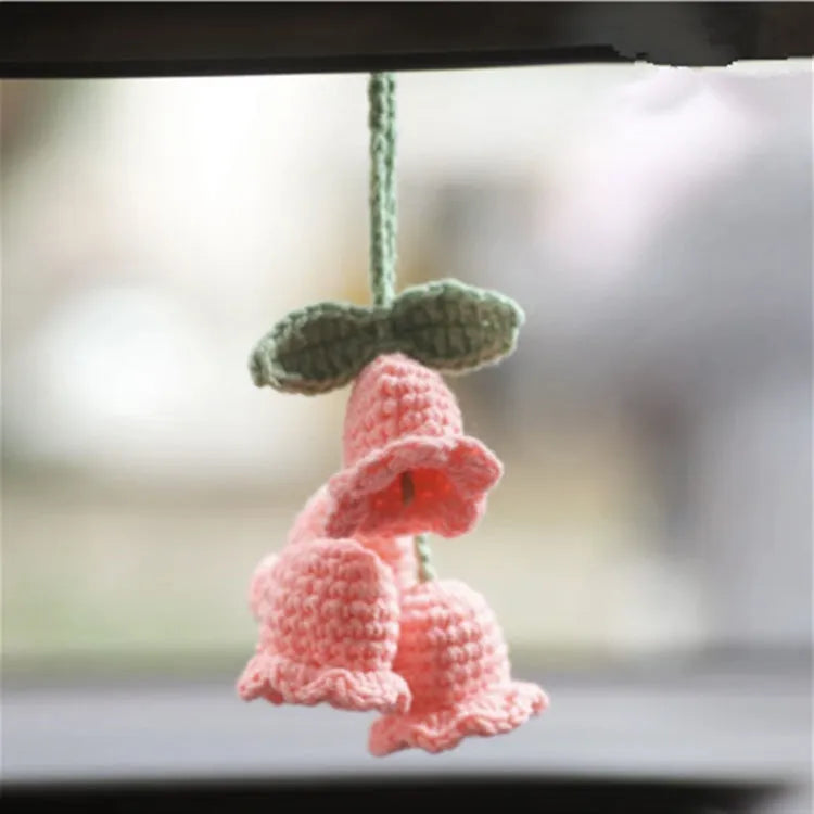Green and white fish-scale style knitted wool car hanging planter with 8cm base and long white cord.