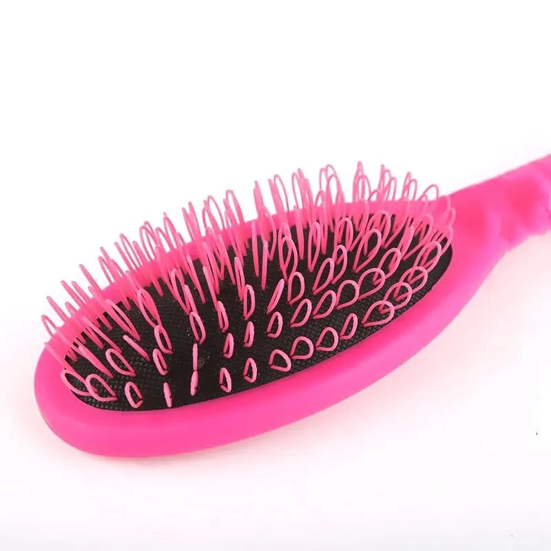 Black ring tooth hair extension comb with airbag cushion measuring 22cm long