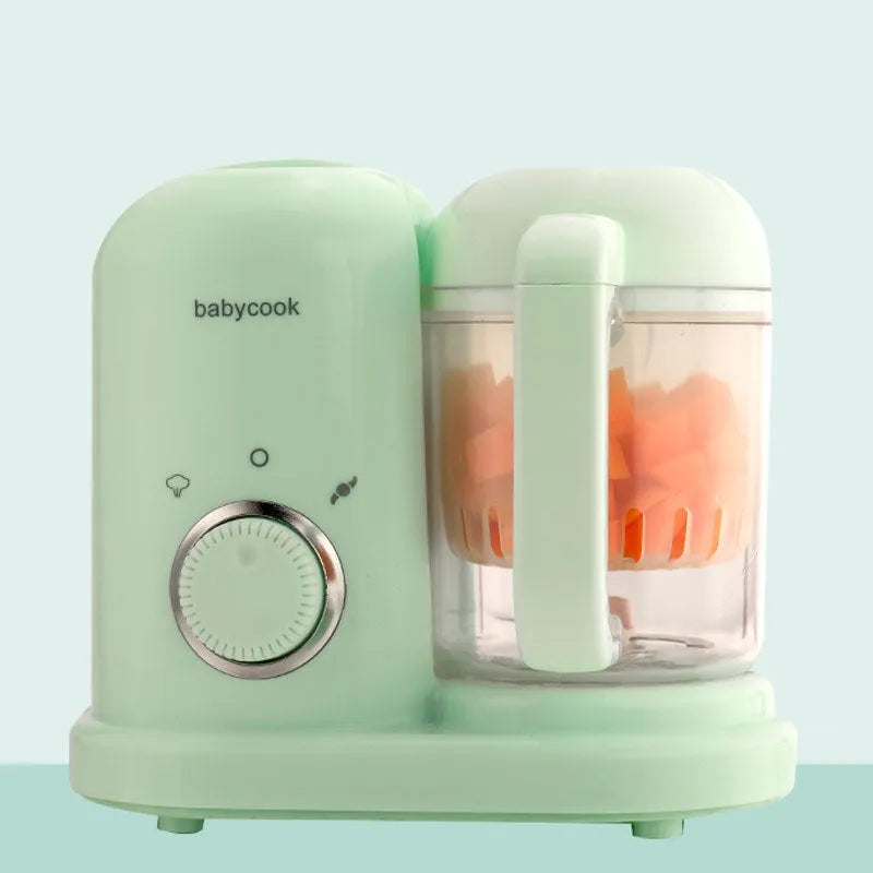 Green and pink baby food processor with steamer and blender functions, showing double mixing blades.