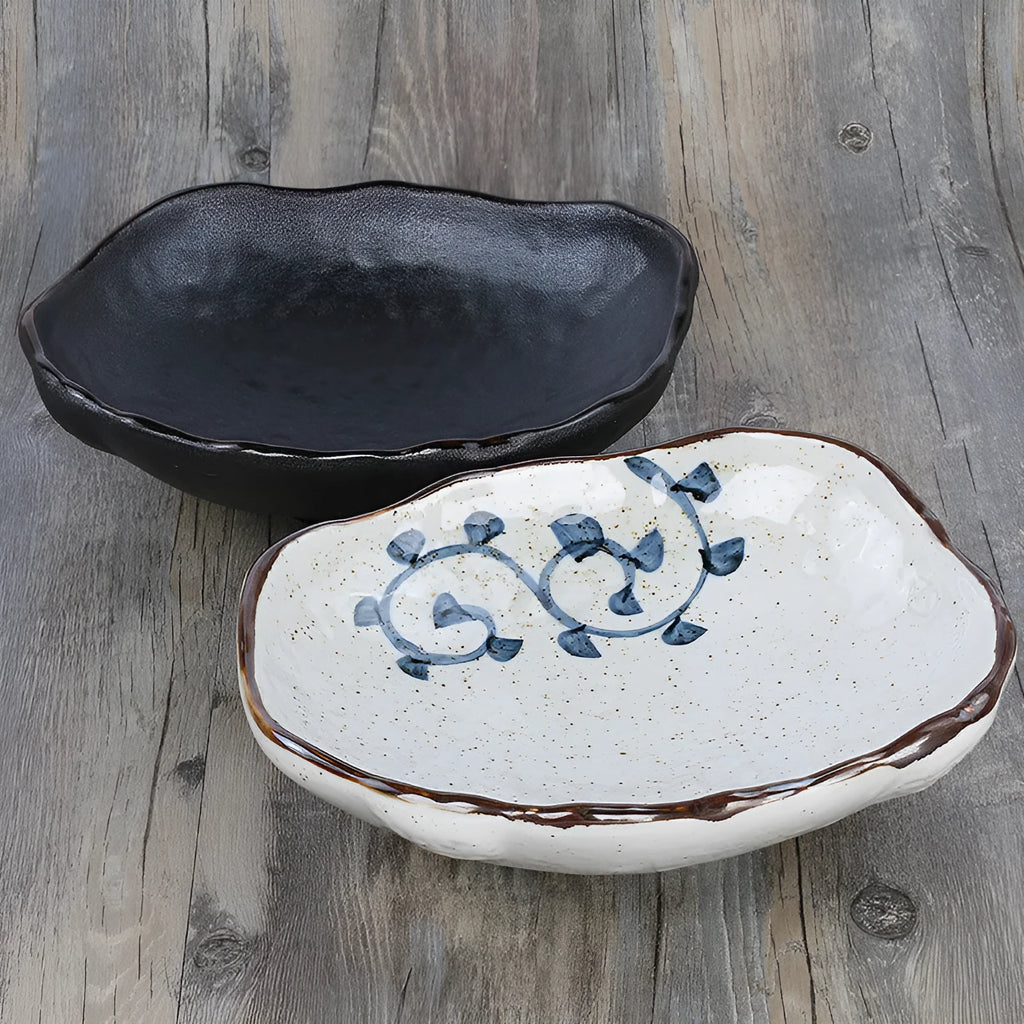 Creative Japanese ceramic sashimi bowl with irregular shape and floral decoration on table