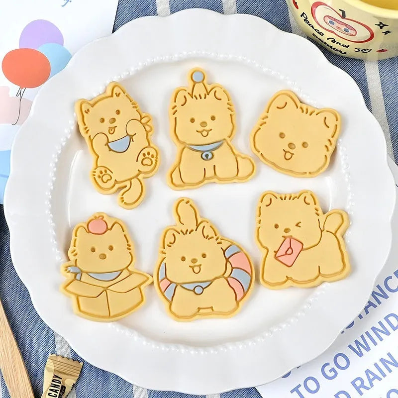 Three dimensional plastic puppy cartoon biscuit mould showing character designs
