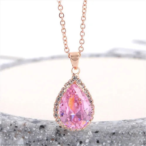 Pink rose gold drop shape rhinestone necklace with geometric design on alloy chain