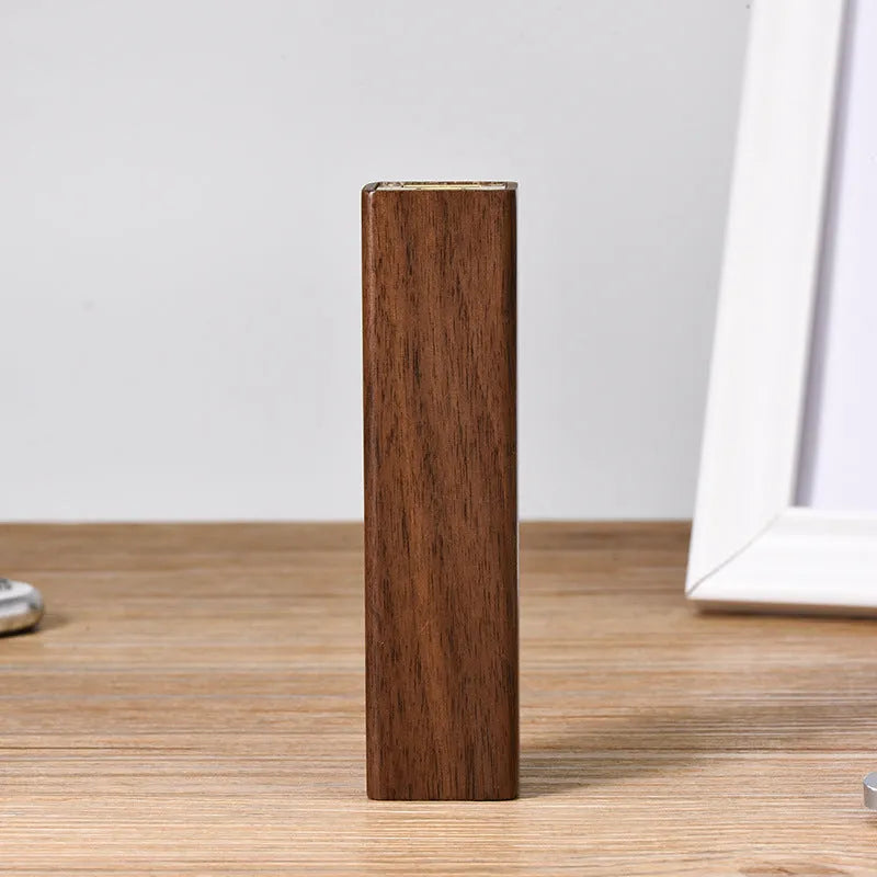 Brown black walnut solid wood portable power bank with 2000mAh capacity.