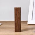 Brown black walnut solid wood portable power bank with 2000mAh capacity.