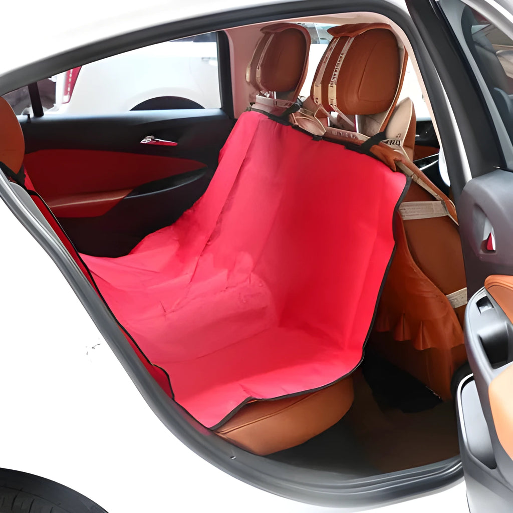 A square, padded car seat protector for pets in blue, showing its size on a vehicle seat.