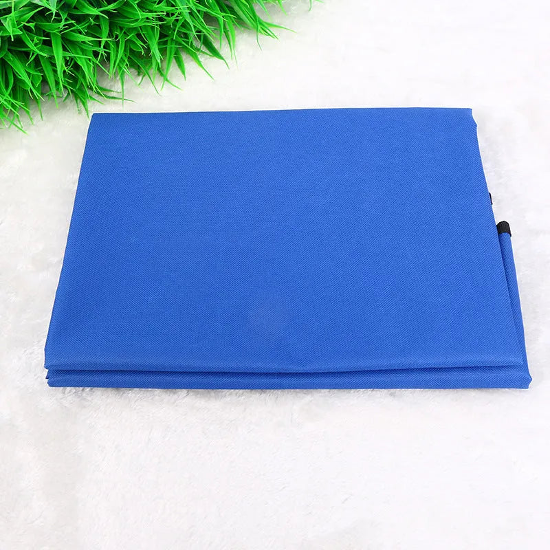 A square, padded car seat protector for pets in blue, showing its size on a vehicle seat.