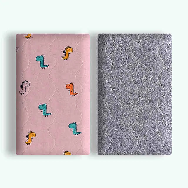 Double-sided cotton wool pet blanket with cartoon dinosaur print lying flat
