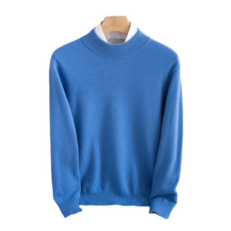 Man wearing a chunky knit half-turtleneck wool sweater in a loose fit.