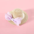 Pink pearl bow woven straw hat for a cat, shown in size S (13cm) on a mannequin head.