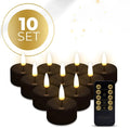 Four black plastic LED tealight candles with flickering flame effect, shown from the side.