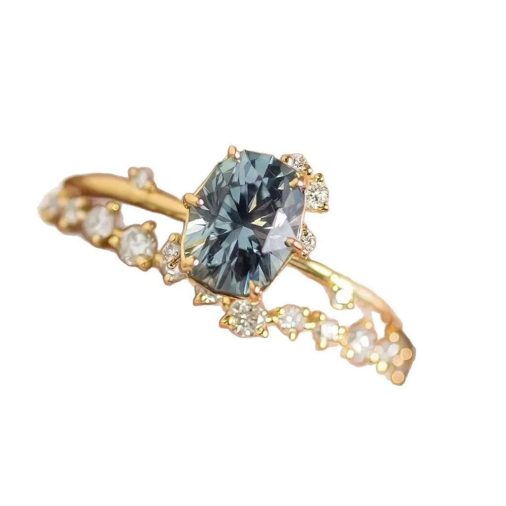 Gold-plated women's ring with flower shape and green zircon stone, shown as a pair.
