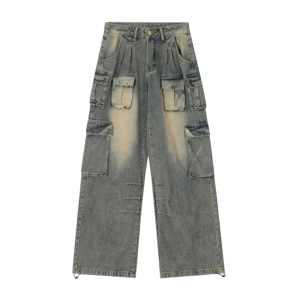 Loose-fit light blue distressed denim jeans with multiple tooling pockets on a straight-leg cut