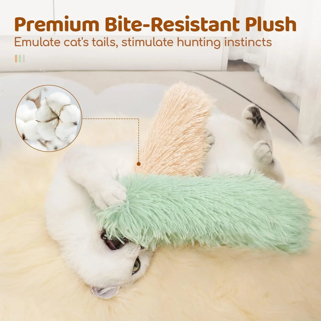Blue, green, pink, and white plush cat toy pillow measuring 27 by 10 centimetres.