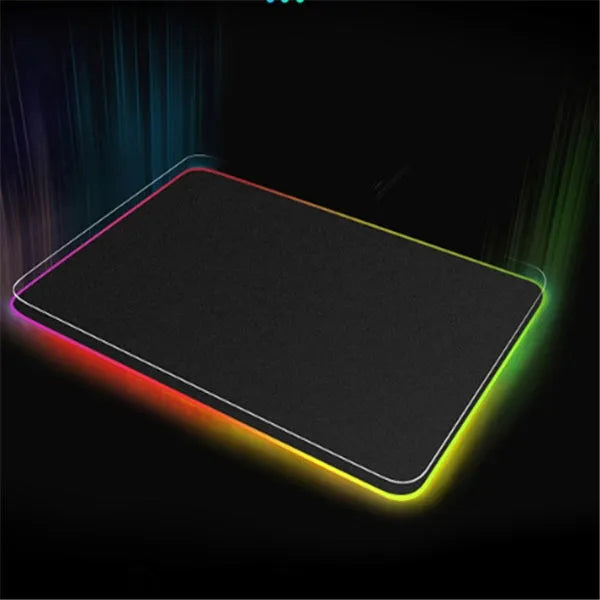 Luminous table mat gaming mouse pad with RGB illumination and non-slip rubber base in black on a wooden desk