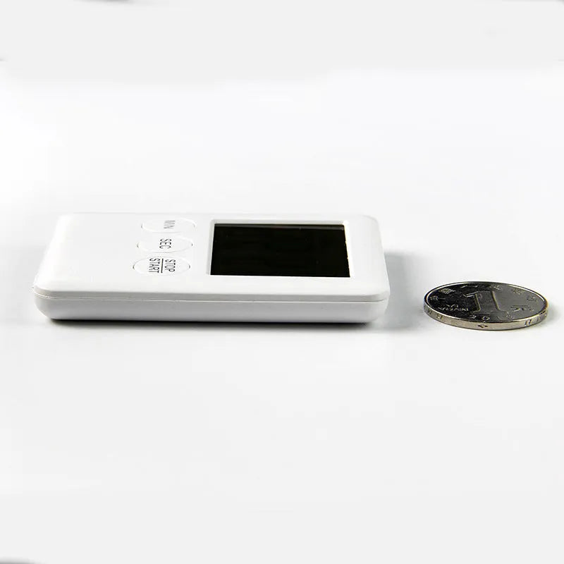 Black and white digital kitchen timer with magnet back, flip-out stand, and large LCD display.