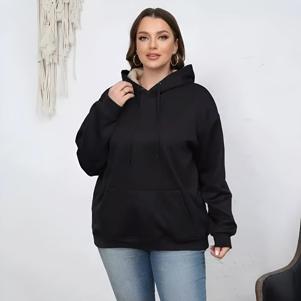 Women's loose black hooded sweater with pockets and a textured 3D pattern