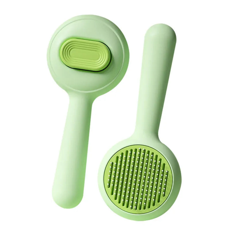 Stainless steel cat grooming brush with non-slip handle in green colour