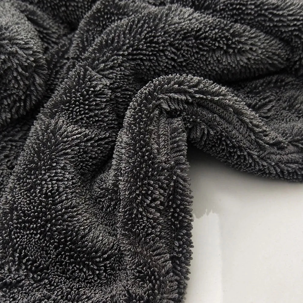 Grey 40x40cm microfiber car wash and drying towel laid flat.