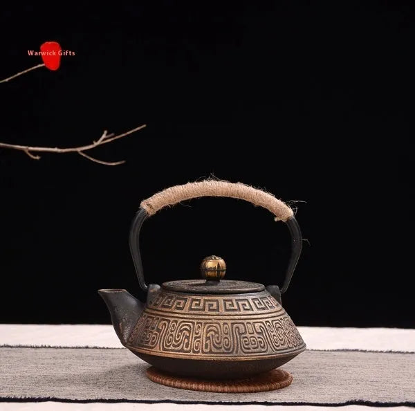 Japanese style cast iron teapot with traditional patterns and 0.9 litre capacity