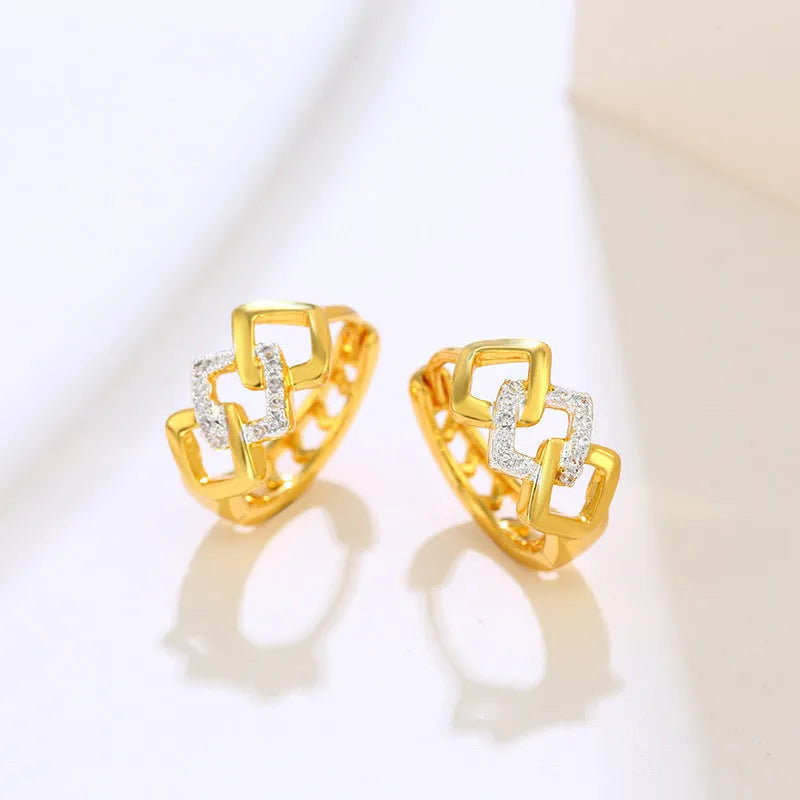 Geometric hollow-out gold electroplated ear clip earrings showing colour separation detail