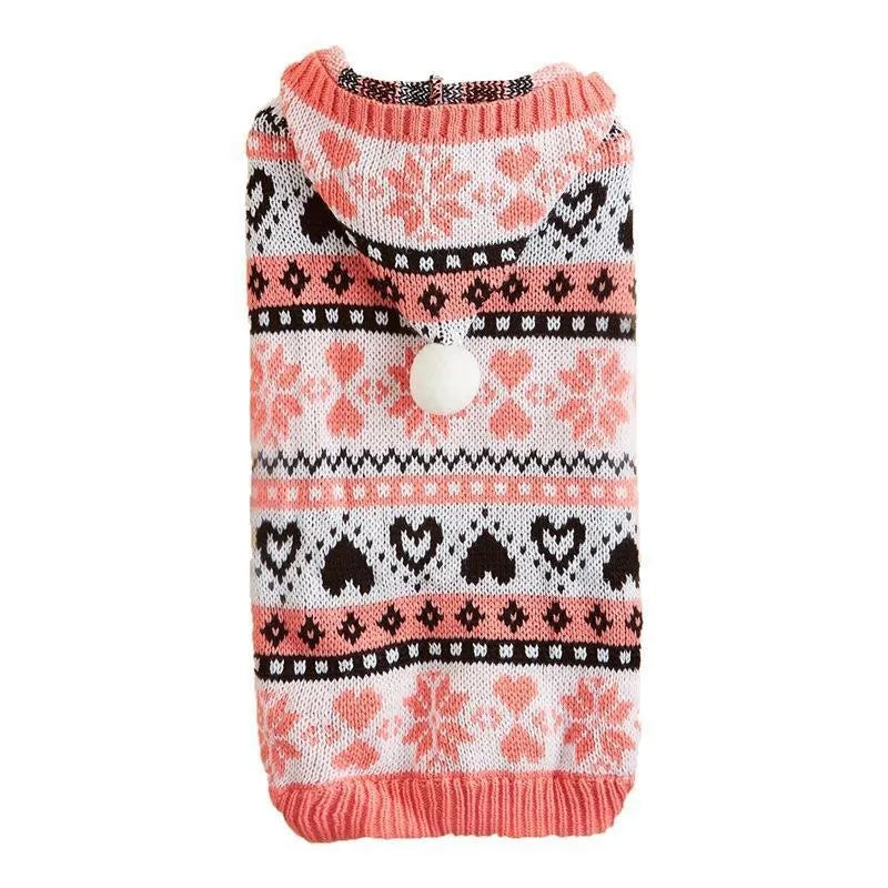Pink striped camouflage dog sweater with snowflake and heart pattern on a small white dog.