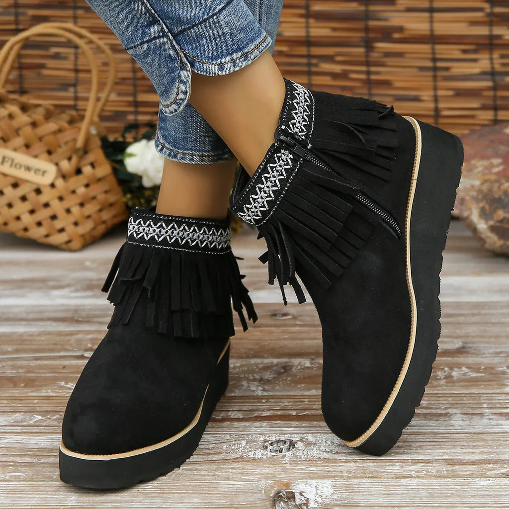Women's dark brown suede wedge ankle boots with a side zip and decorative tassel.