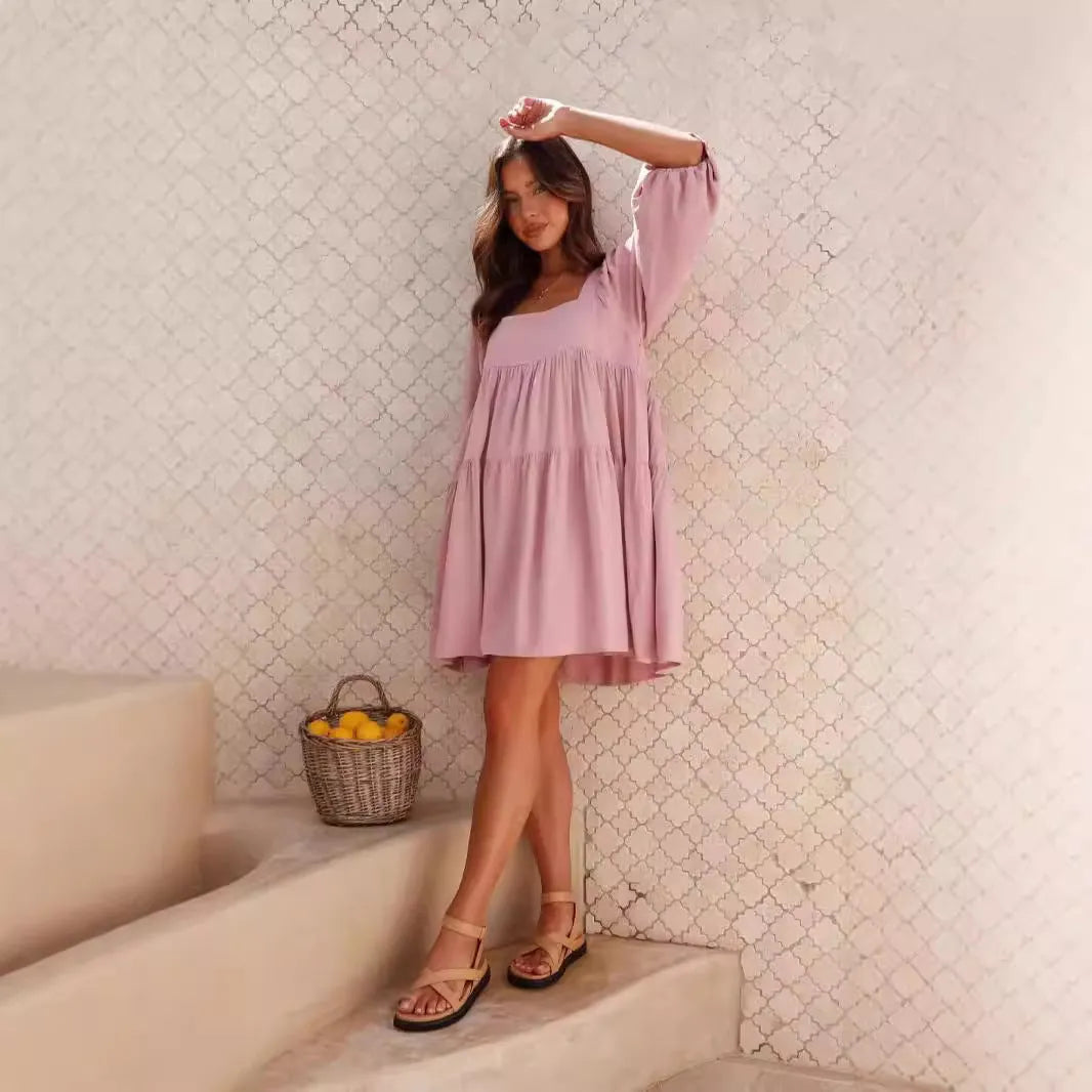 Girl in a light blue square collar puff sleeve backless A-line summer dress.