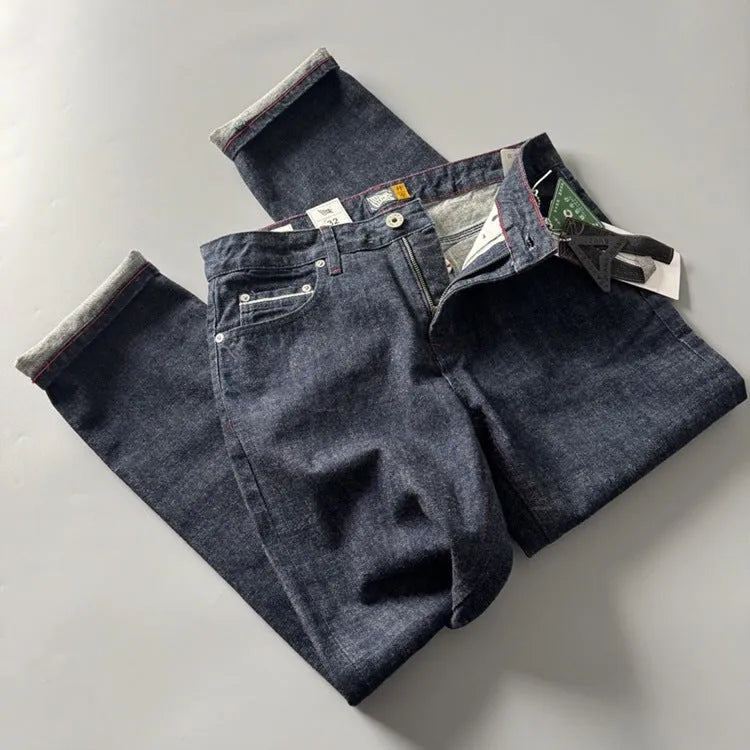 Men's primary colour straight leg jeans in American retro style laid flat, showing the mid waist and full-length leg.
