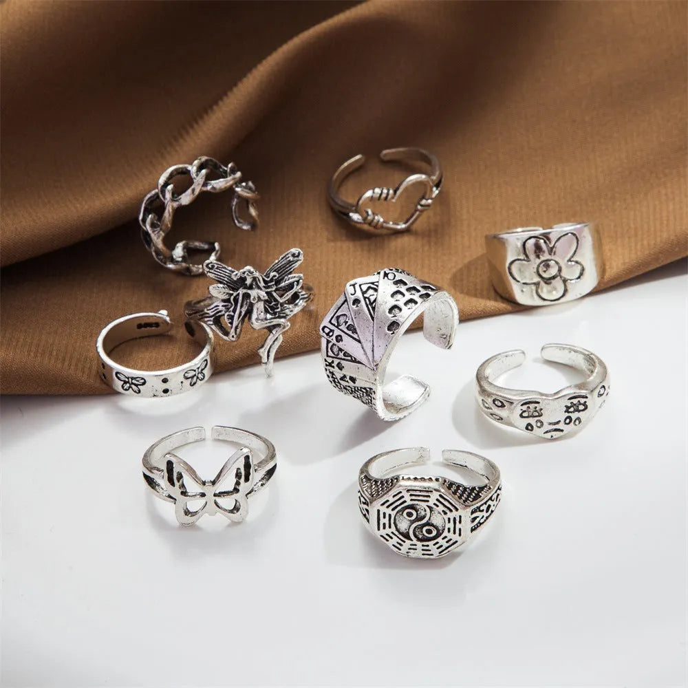 Alloy ring set with butterfly and snake retro geometric designs on display