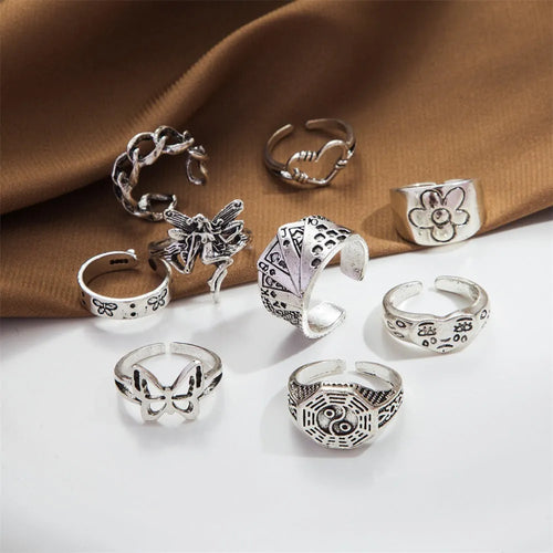 Alloy ring set with butterfly and snake retro geometric designs on display