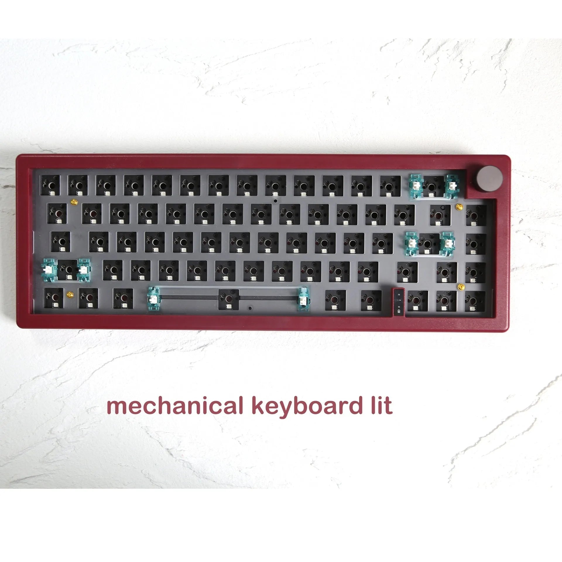 DIY mechanical keyboard kit components with RGB keys and knob on a black ABS case.