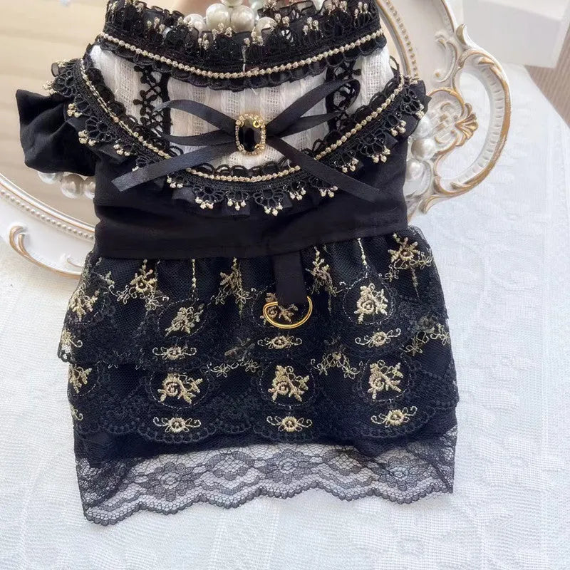 Golden gothic princess-style dress for a small dog or cat on a mannequin.