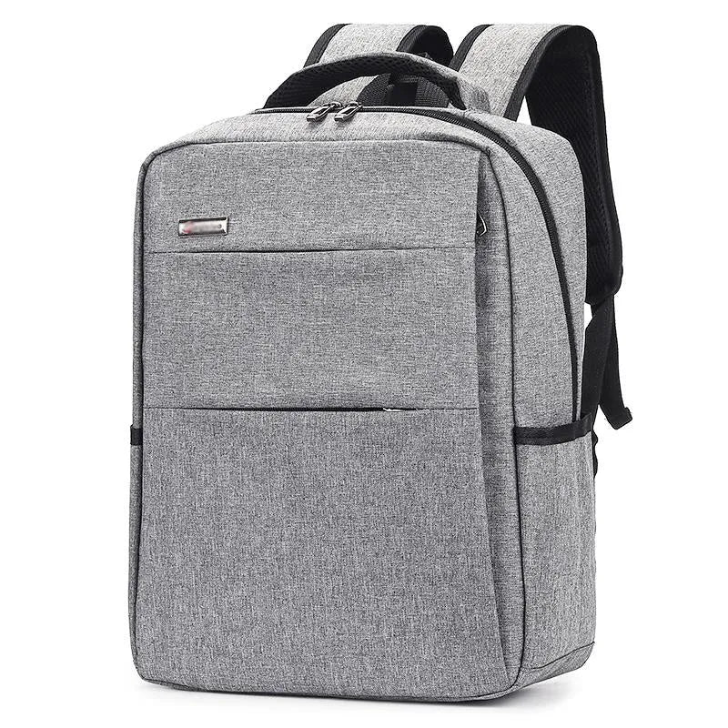 Waterproof rechargeable laptop backpack in multiple colours, shown with a 15.6 inch laptop in its padded compartment.
