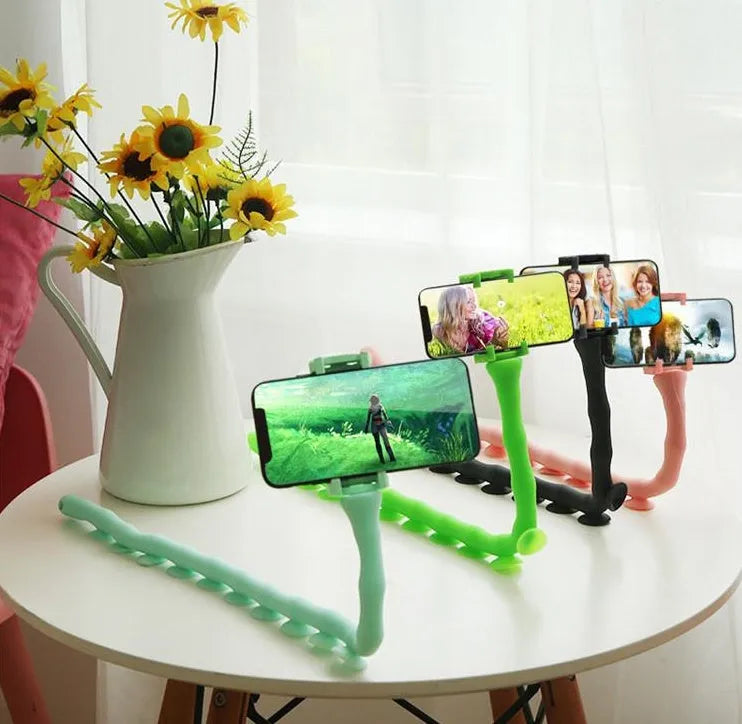 Flexible rubber phone holder with suction cup mount showing 360 degree rotation capability